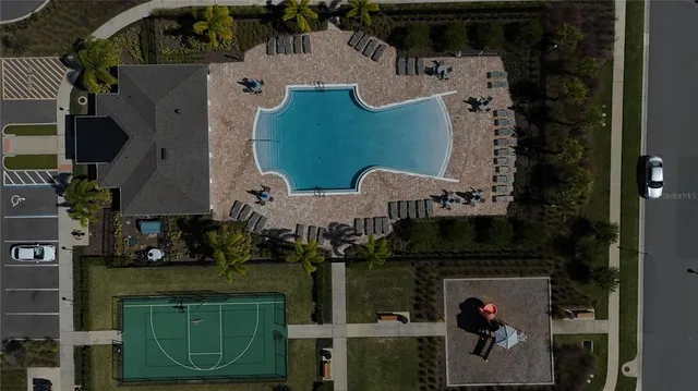 an aerial view of a house with a yard