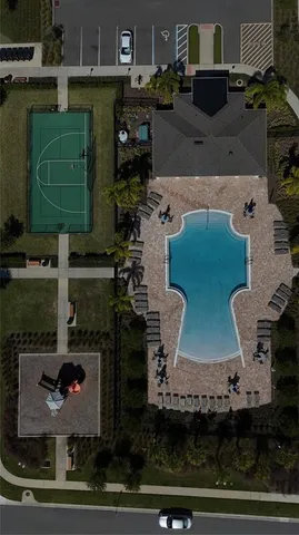 an aerial view of a house with a yard