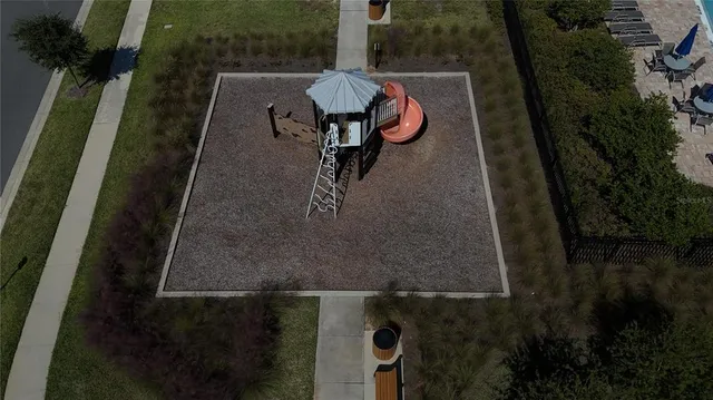 an aerial view of a house with yard