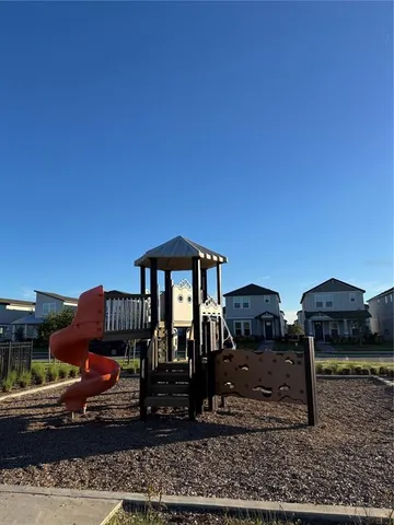 a front view of a house with sitting area