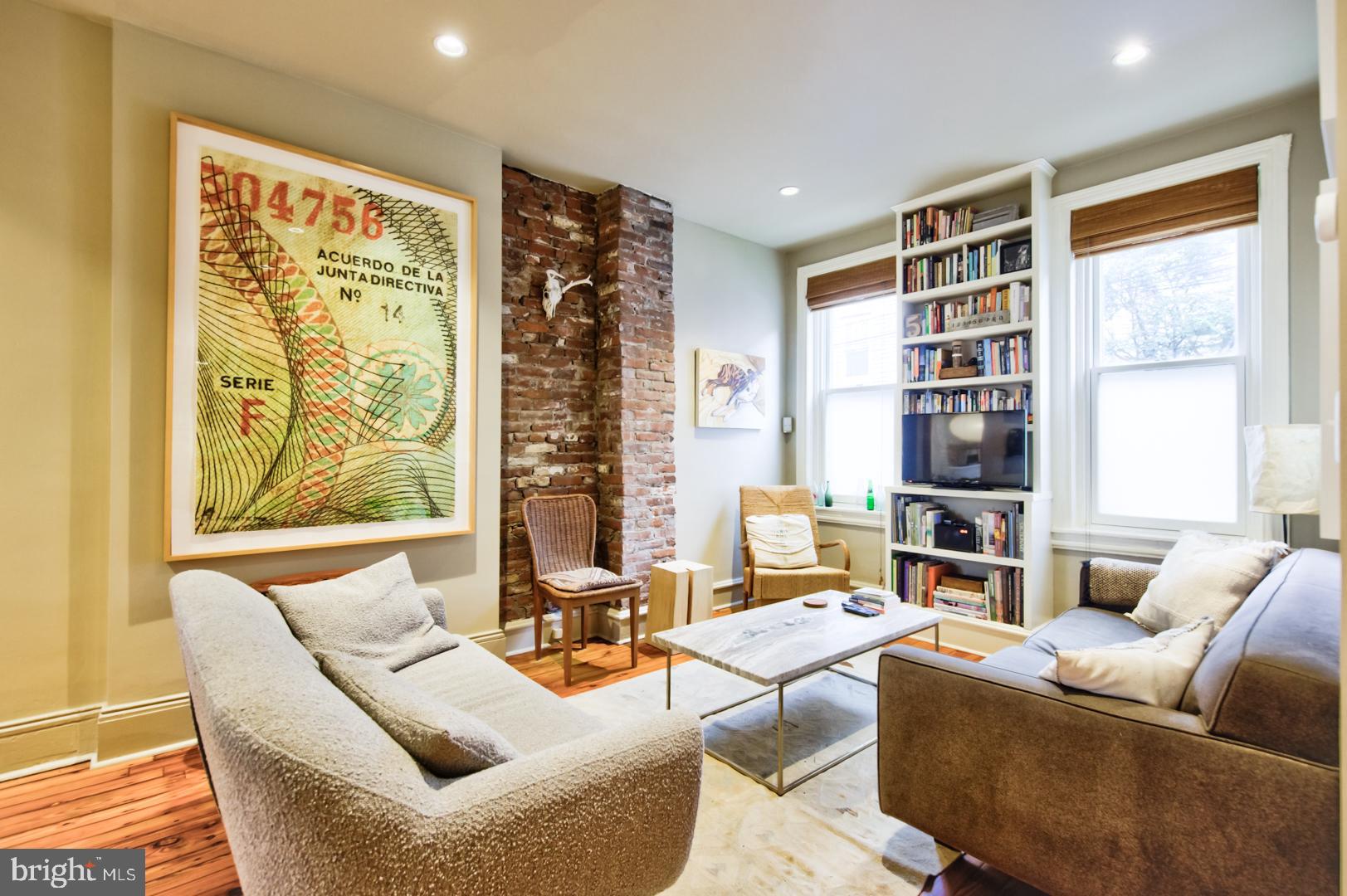 751 North Taylor Street Philadelphia, PA 19130 - Photo 1 of 21 a living room with furniture and a large window