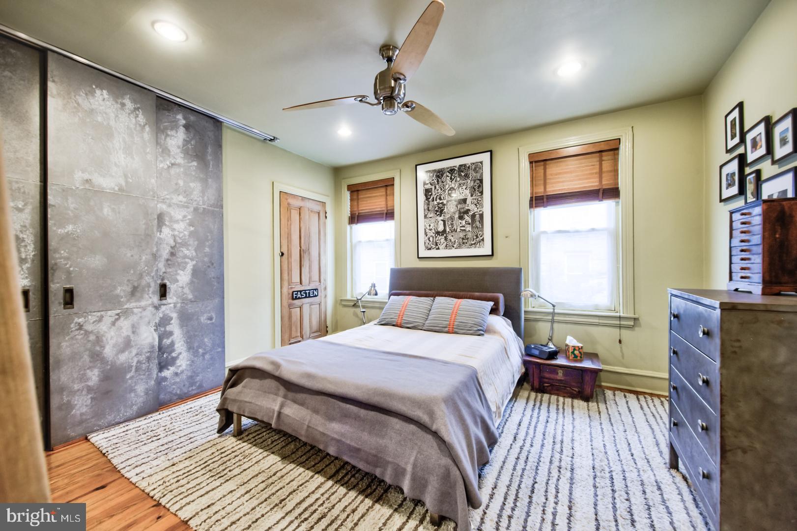 751 North Taylor Street Philadelphia, PA 19130 - Photo 11 of 21 a spacious bedroom with a bed and a dresser with wooden floor