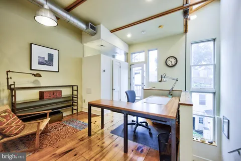 a view of a livingroom with furniture and window