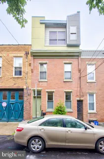 a front view of a house with parking space
