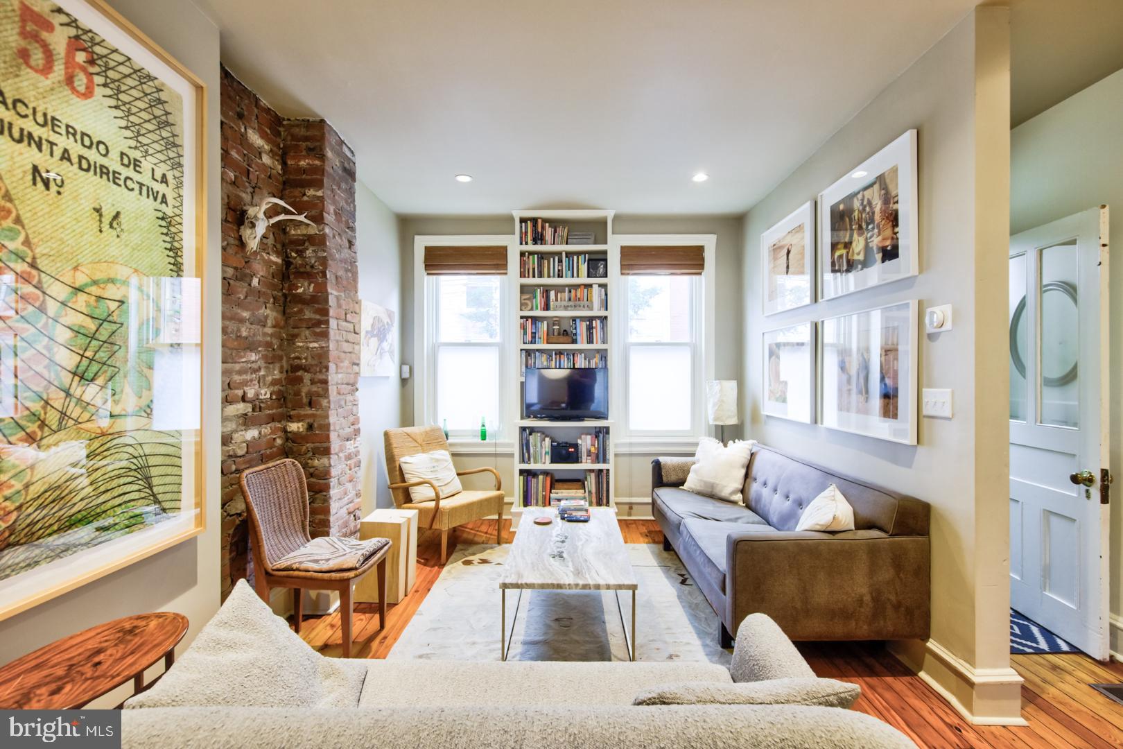 751 North Taylor Street Philadelphia, PA 19130 - Photo 3 of 21 a living room with furniture and a large window