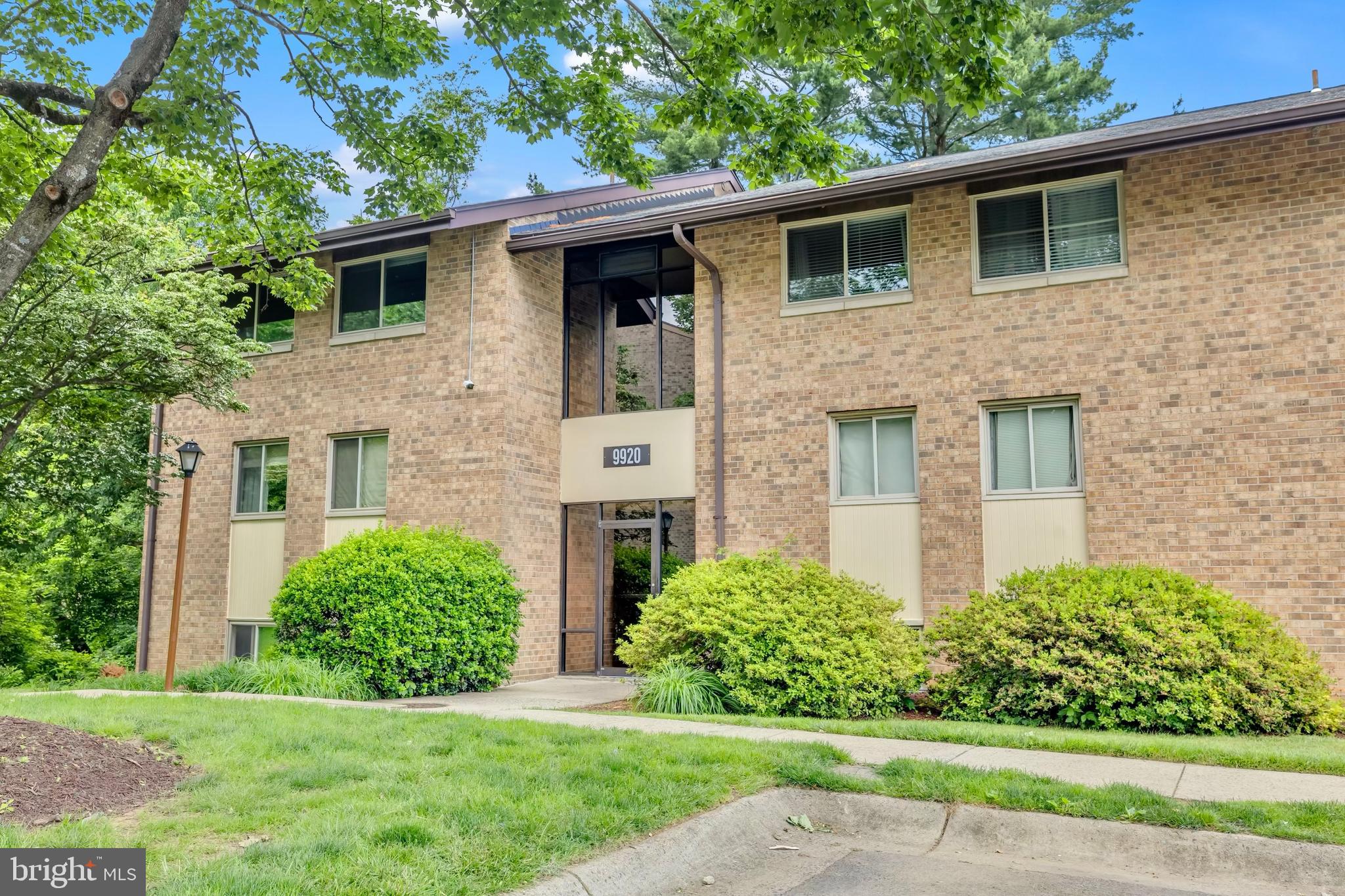 9920 Walker House Road, Unit 5 Gaithersburg, MD 20886 - Photo 1 of 24 a front view of a house with a yard