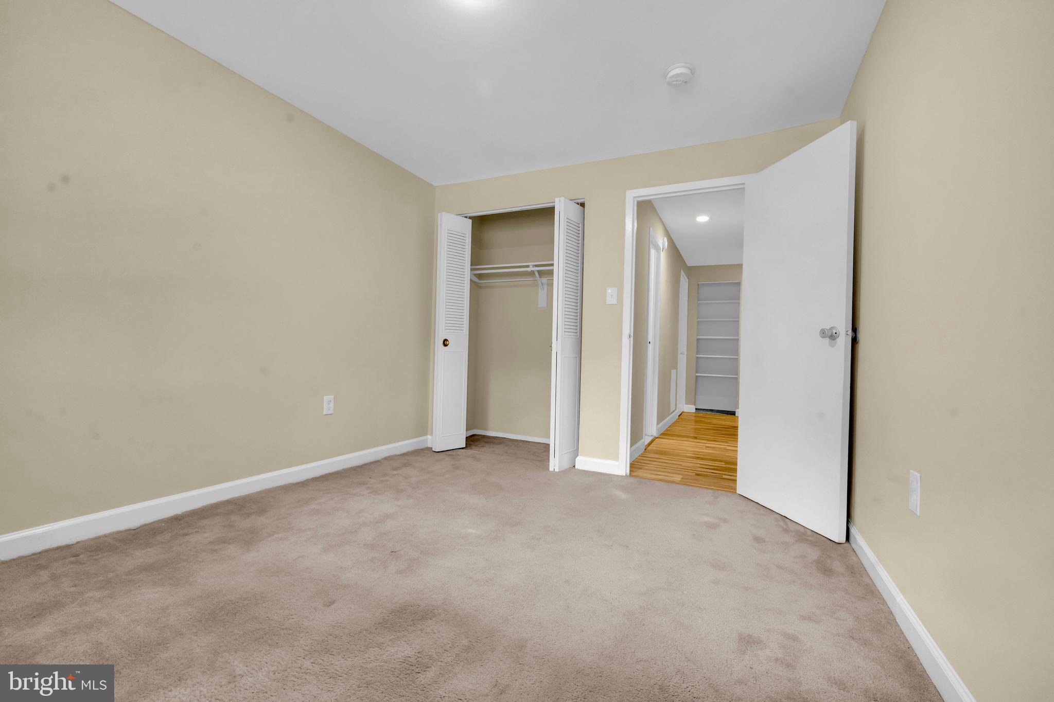 9920 Walker House Road, Unit 5 Gaithersburg, MD 20886 - Photo 12 of 24 an empty room with an entryway door