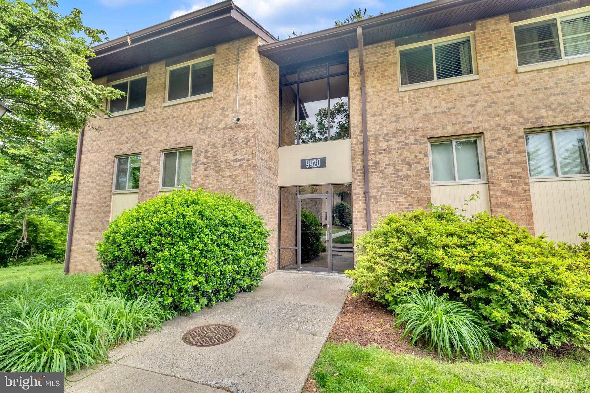 9920 Walker House Road, Unit 5 Gaithersburg, MD 20886 - Photo 2 of 24 a front view of a house with garden