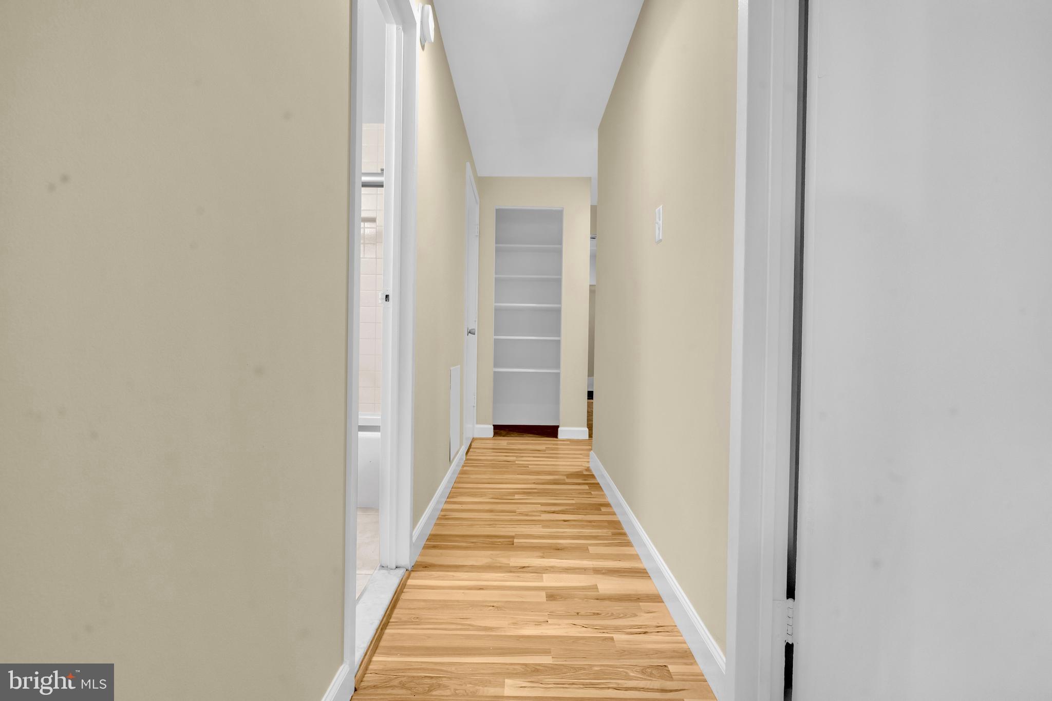 9920 Walker House Road, Unit 5 Gaithersburg, MD 20886 - Photo 8 of 24 a view of a hallway with wooden floor
