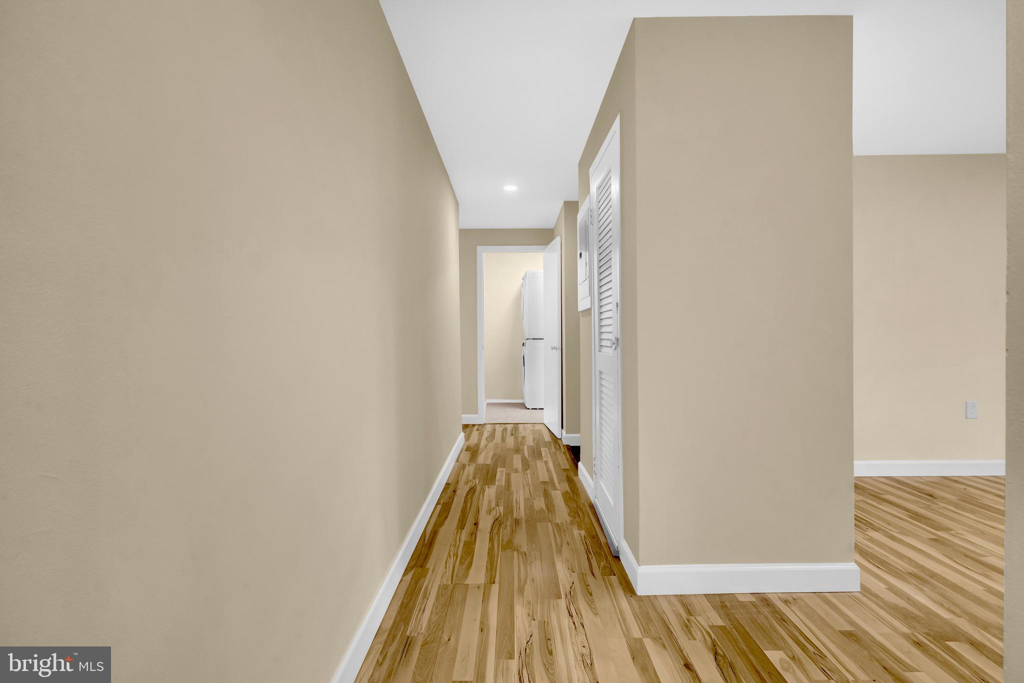 9920 Walker House Road, Unit 5 Gaithersburg, MD 20886 - Photo 9 of 24 a view of a hallway with wooden floor