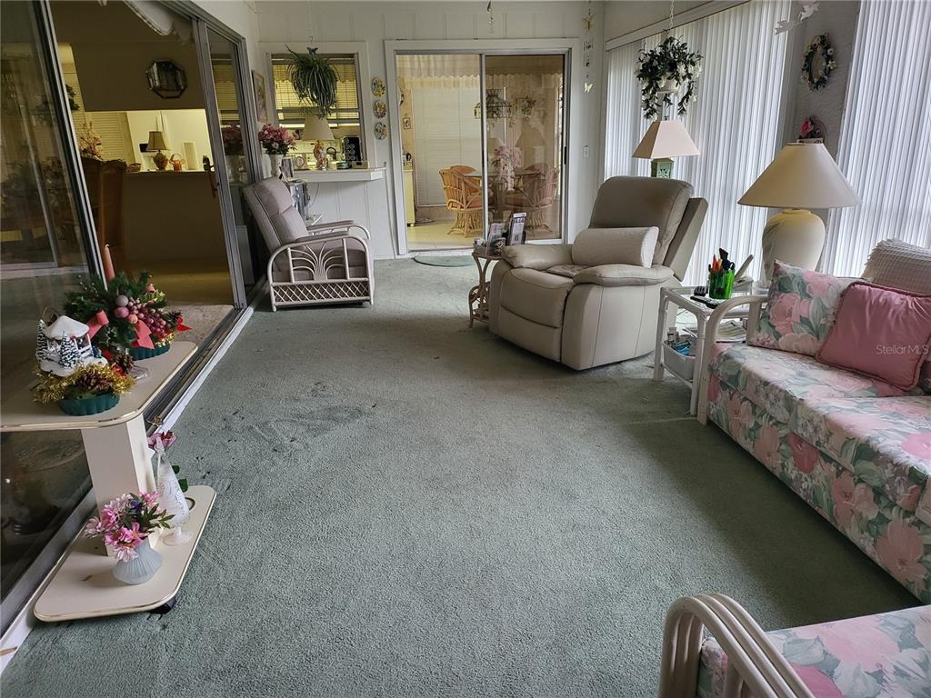 2687 Royal Ridge Drive Spring Hill, FL 34606 - Photo 11 of 15 a living room with furniture and a flat screen tv