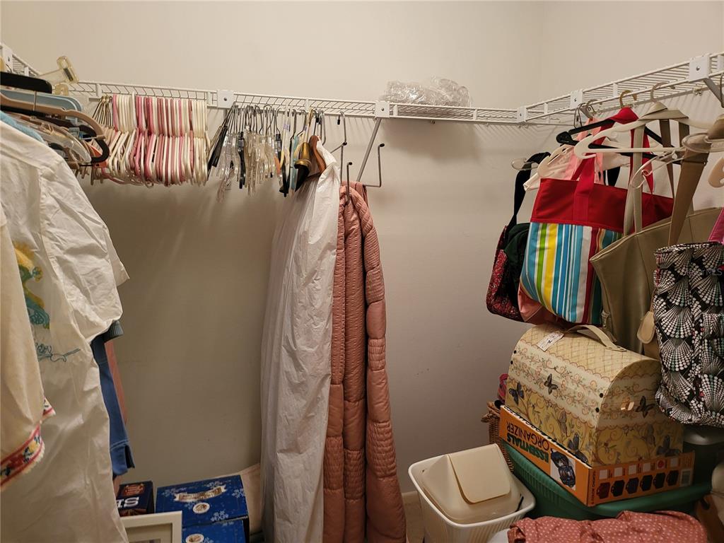 2687 Royal Ridge Drive Spring Hill, FL 34606 - Photo 12 of 15 a view of walk in closet with clothes and shoes