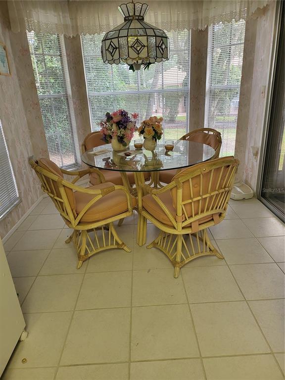 2687 Royal Ridge Drive Spring Hill, FL 34606 - Photo 8 of 15 a dining room with furniture and window
