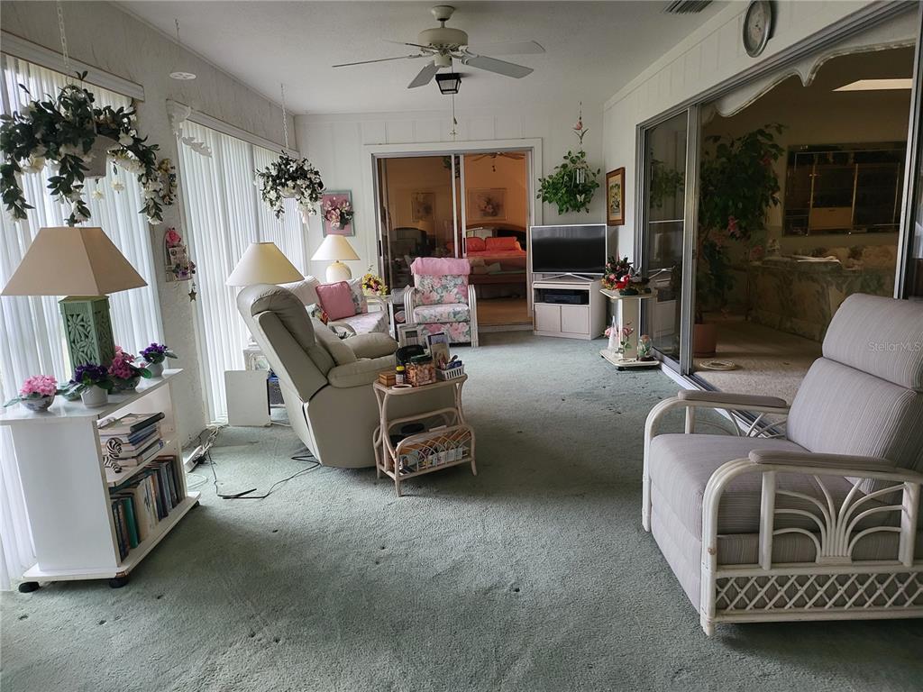 2687 Royal Ridge Drive Spring Hill, FL 34606 - Photo 10 of 15 a living room with furniture and a flat screen tv