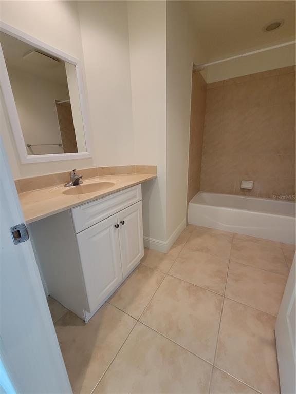 1771 Ringling Boulevard, Unit 902 Sarasota, FL 34236 - Photo 18 of 60 a bathroom with a sink and a mirror