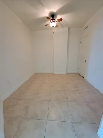 a view of an empty room and window in a room