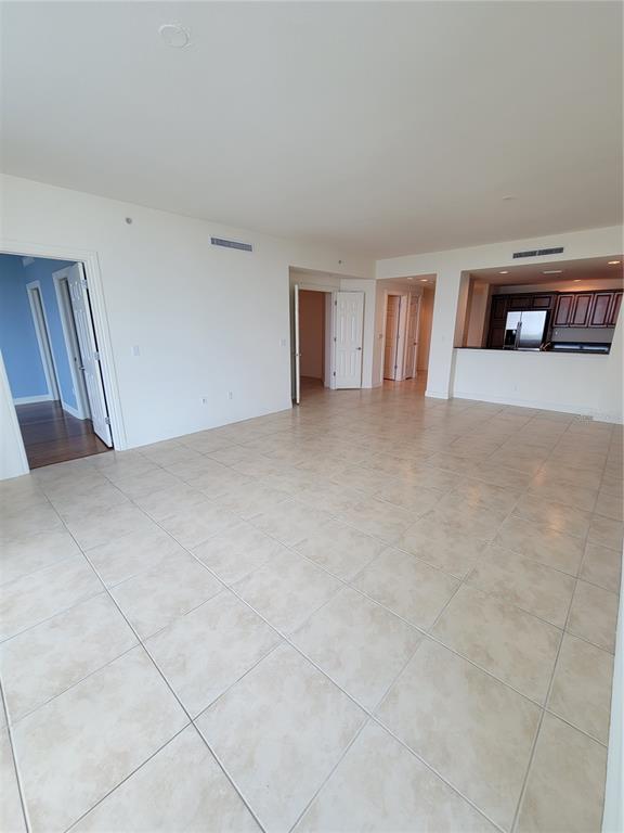 1771 Ringling Boulevard, Unit 902 Sarasota, FL 34236 - Photo 24 of 60 a view of an empty room with window and workspace