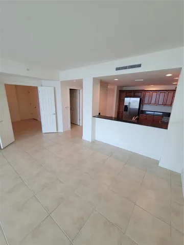 a view of a room with wooden floor