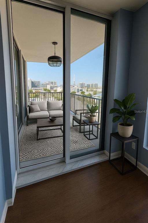 1771 Ringling Boulevard, Unit 902 Sarasota, FL 34236 - Photo 32 of 60 a view of a floor to ceiling window and a couch