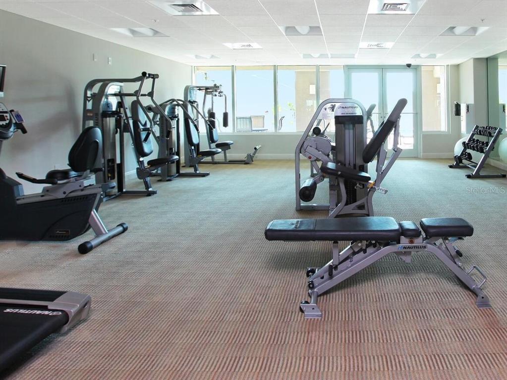 1771 Ringling Boulevard, Unit 902 Sarasota, FL 34236 - Photo 43 of 60 a view of a room with gym equipment