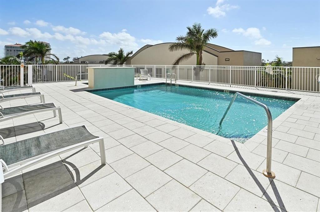1771 Ringling Boulevard, Unit 902 Sarasota, FL 34236 - Photo 45 of 60 a swimming pool with a yard