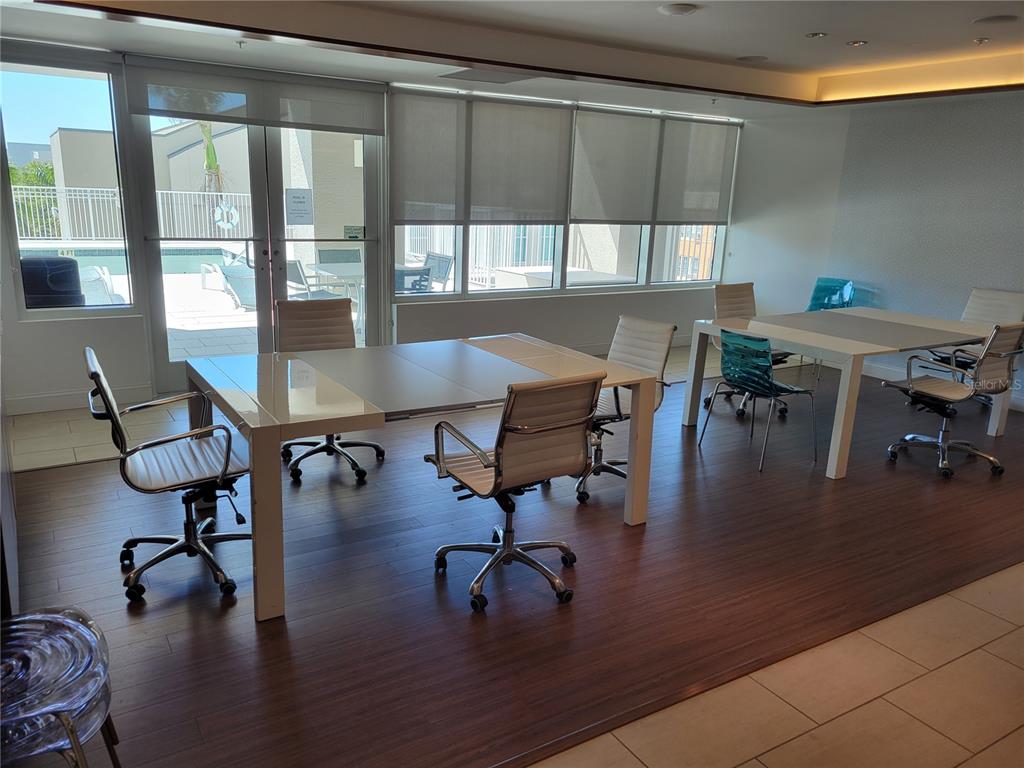 1771 Ringling Boulevard, Unit 902 Sarasota, FL 34236 - Photo 47 of 60 a workspace with furniture window and wooden floor