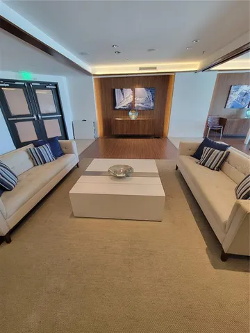 a view of a street with cars parked