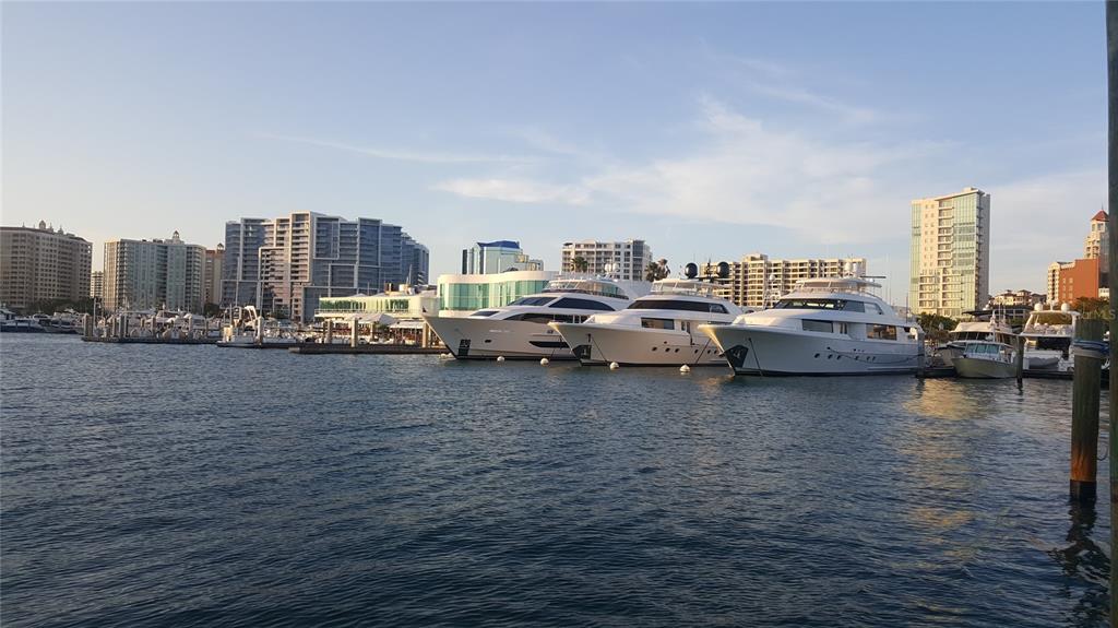 1771 Ringling Boulevard, Unit 902 Sarasota, FL 34236 - Photo 59 of 60 a very nice looking room with a large window and a white wooden floor