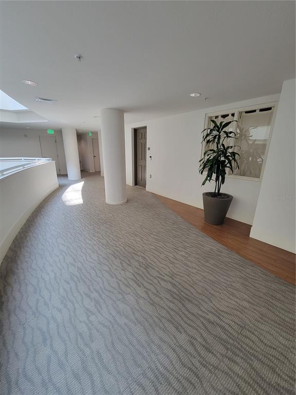1771 Ringling Boulevard, Unit 902 Sarasota, FL 34236 - Photo 9 of 60 a view of a living room and hardwood floor