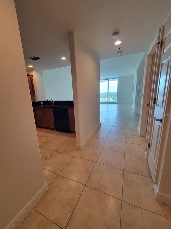 1771 Ringling Boulevard, Unit 902 Sarasota, FL 34236 - Photo 10 of 60 a view of entryway with kitchen and a window