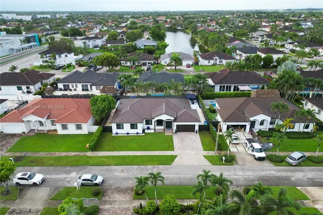 an aerial view of a house with a garden