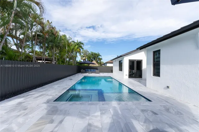 a view of a backyard of the house