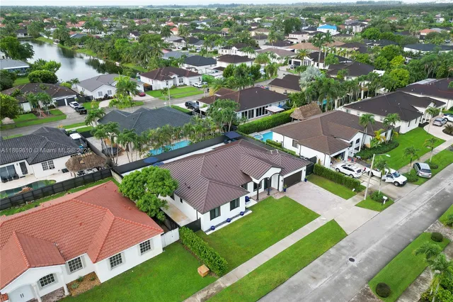 an aerial view of a house with a garden