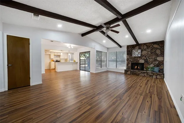 a view of a livingroom with wooden floor