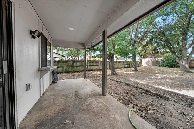 a view of a porch with a backyard of the house