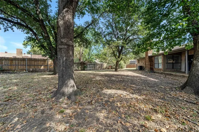 a backyard of a house with lots of green space