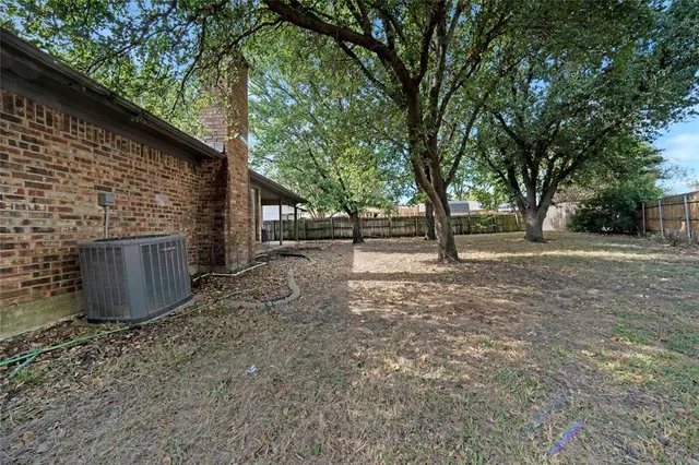 a view of outdoor space with deck and tree