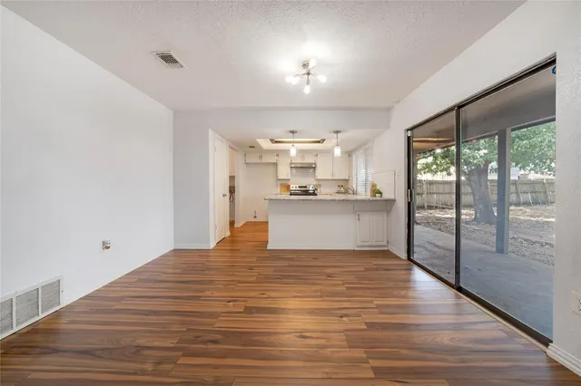 a view of kitchen with wooden floor
