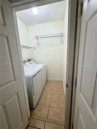 a utility room with a sink a washer and dryer