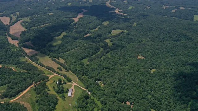 an aerial view of house with yard