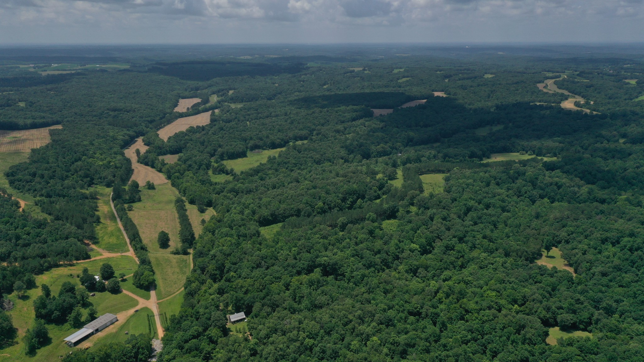 1092 Shoulder Strap Branch Road Vanleer, TN 37181 - Photo 9 of 14 an aerial view of residential house with outdoor space and trees all around