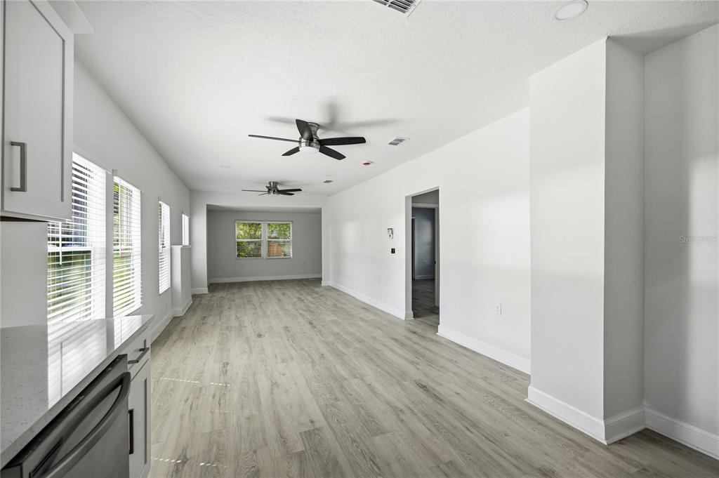 418 Northwest 3rd Avenue Gainesville, FL 32601 - Photo 16 of 31 wooden floor in an empty room with a window