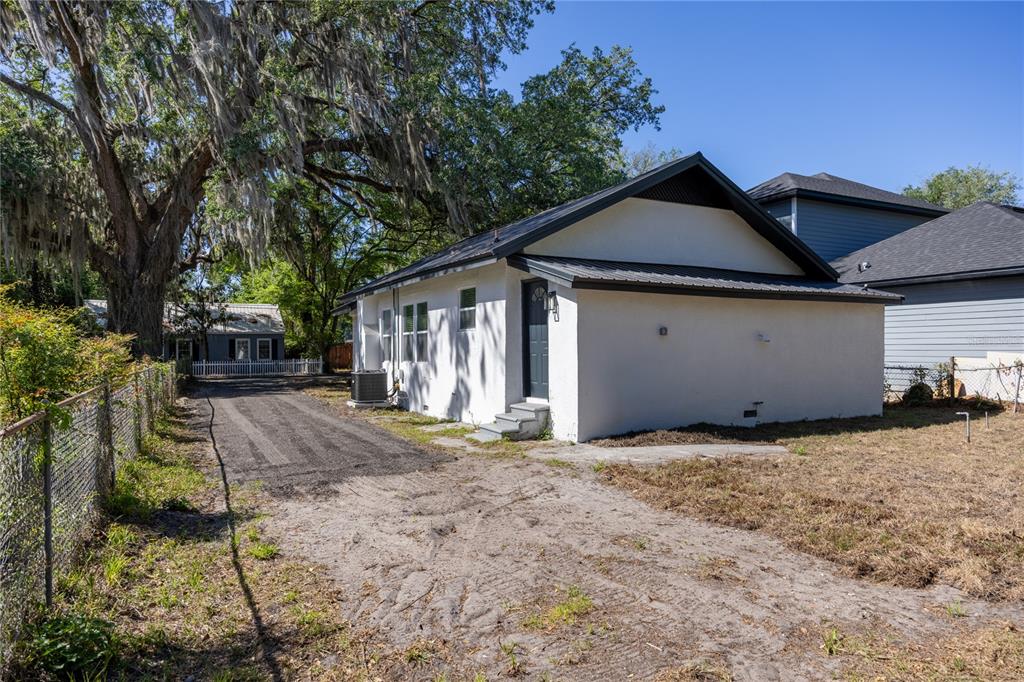 418 Northwest 3rd Avenue Gainesville, FL 32601 - Photo 27 of 31 a view of a house with a yard and garage