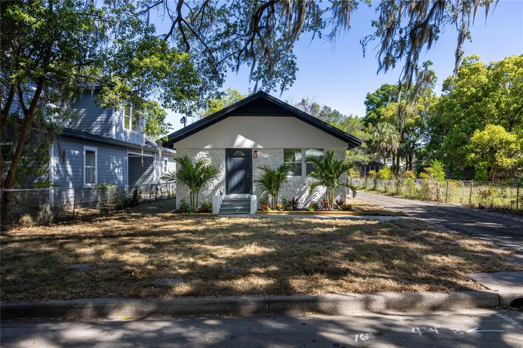 418 Northwest 3rd Avenue Gainesville, FL 32601 - Photo 5 of 31 a view of a house with a yard and tree s