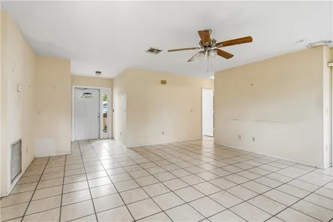 a view of a livingroom with wooden floor and window