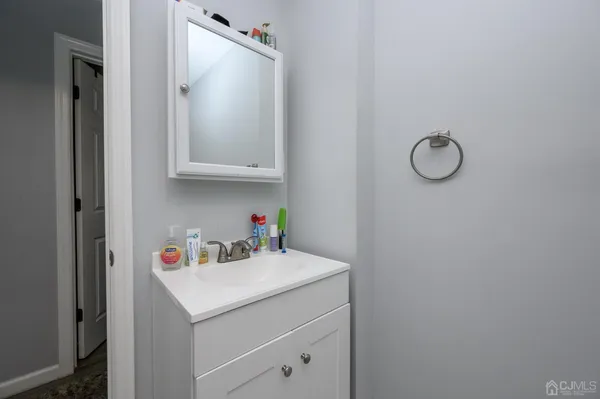a utility room with sink dryer and washer