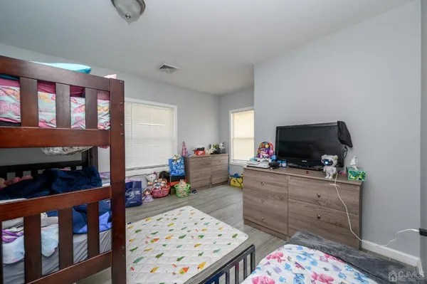 a room with furniture a flat screen tv and a fireplace