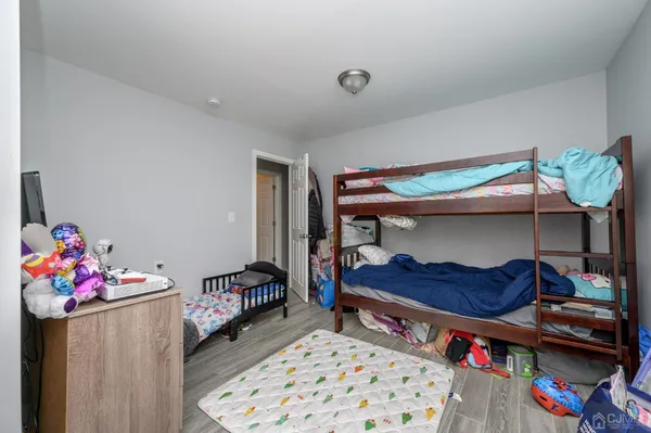 a bedroom with furniture and a potted plant