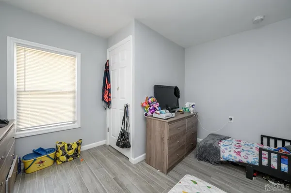 a room with furniture and book shelf