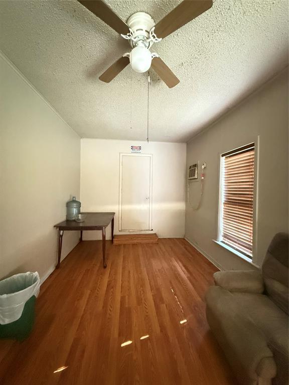 819 Mignon Street Minden, LA 71055 - Photo 4 of 9 a bedroom with a bed and a chandelier